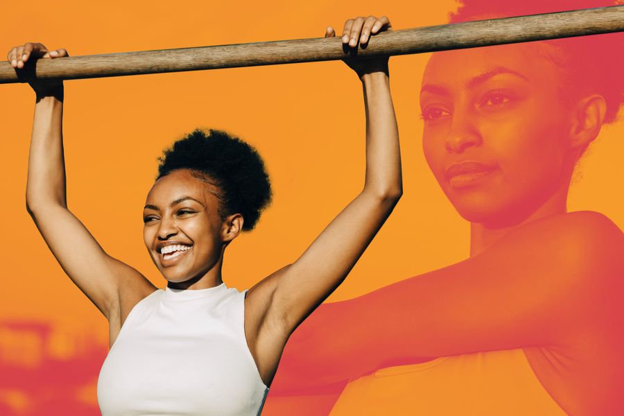 a woman holding a bar preparing to do a pull-up calisthenics exercise