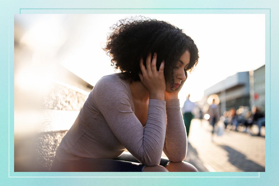 Sad Woman Leaning Over Knees