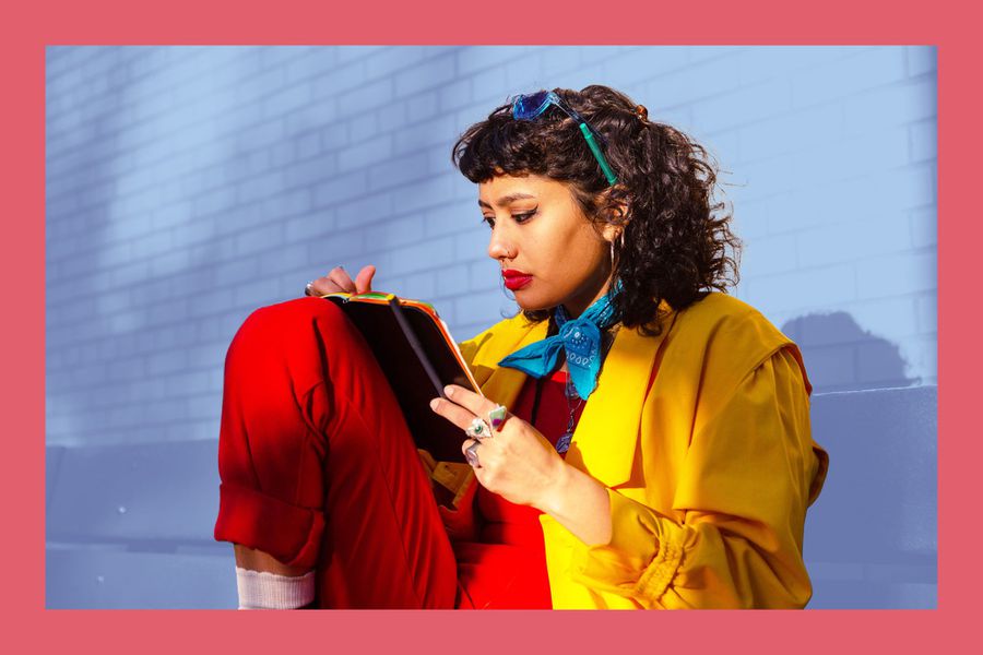 The Best Guided Journals, Picked By Mental Health Pros , young woman writing on notebook at sunset in park