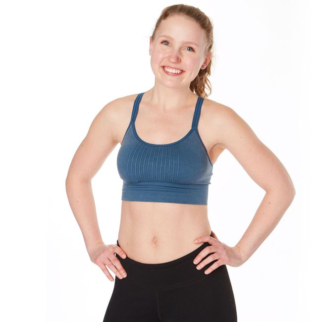 woman with blonde hair smiling at the camera before demonstrating plank exercise variations