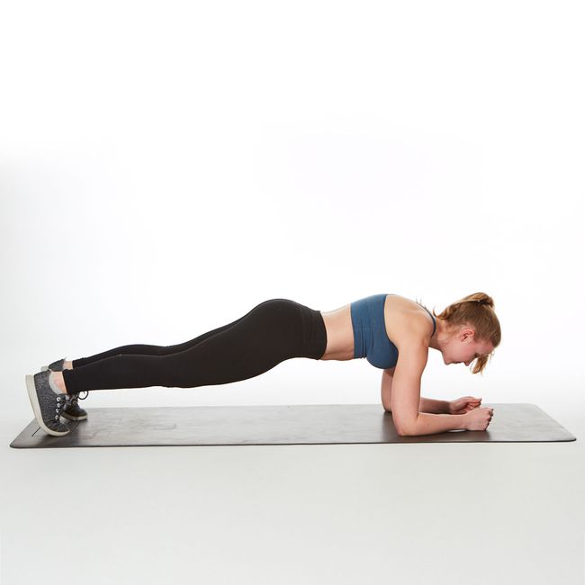 are planks good for abs? instructor demonstrating how to do a forearm plank exercise