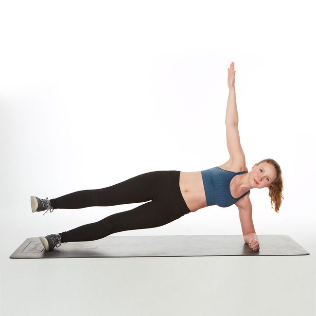 are planks good for abs? instructor demonstrating how to do a side plank with leg lift plank exercise