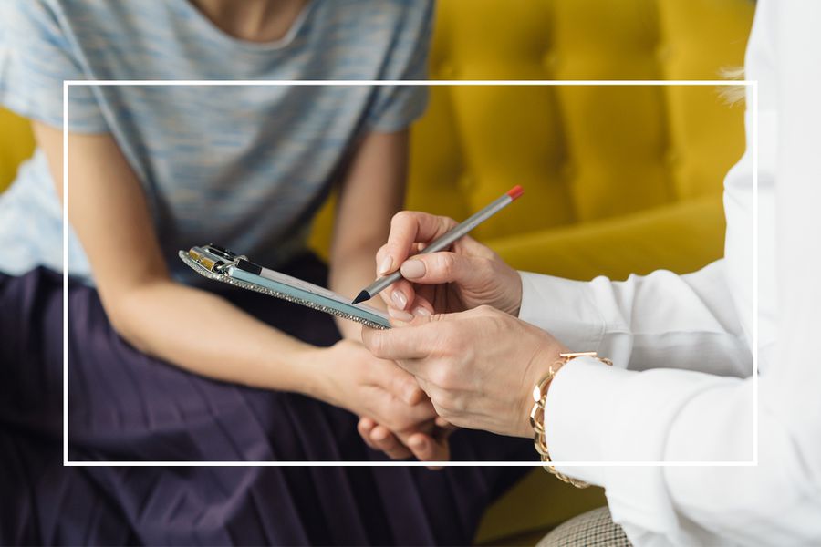 Woman Speaking with Doctor